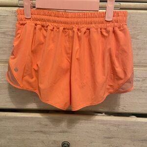 Orange lulu lemon hotty hot shorts. 2.5 inch. Size 8